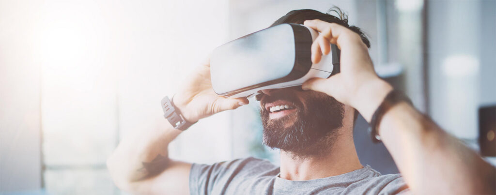 Man using generic Google Cardboard VR viewer